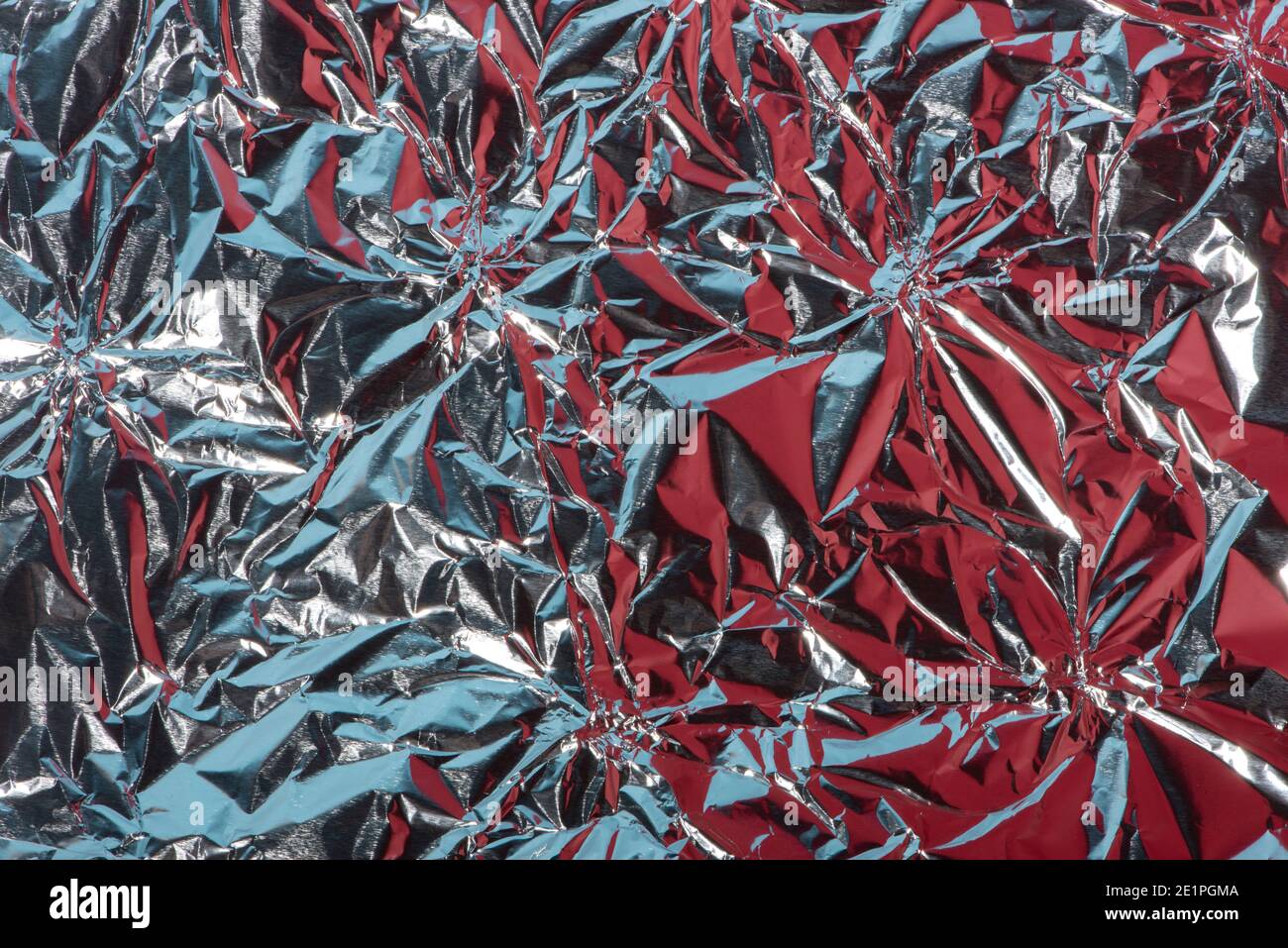 Abstract background with crumpled foil texture, silver, re Stock Photo