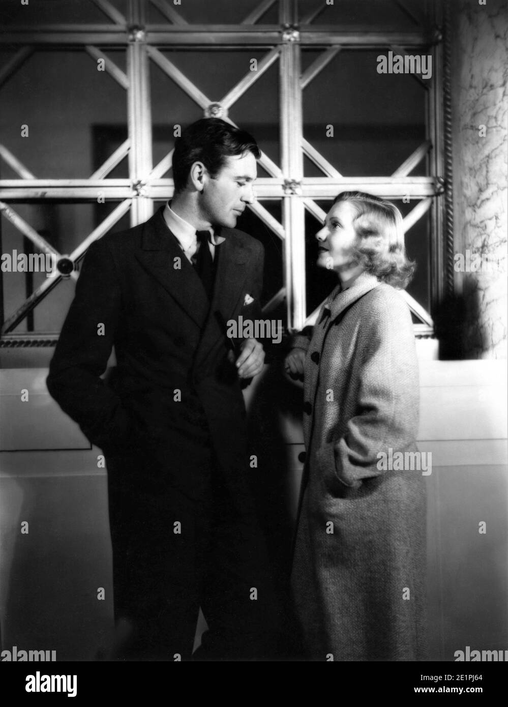 GARY COOPER and JEAN ARTHUR on set candid portrait during filming of MR