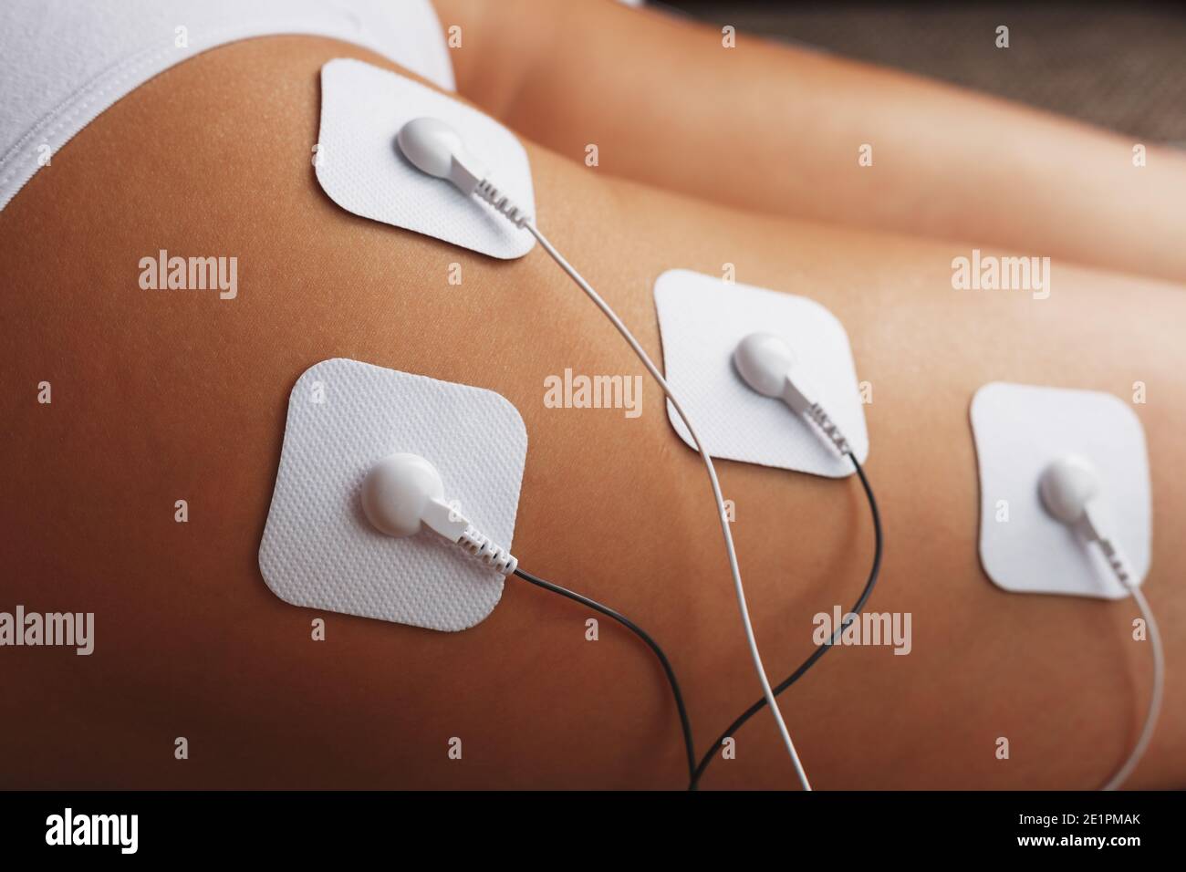 https://c8.alamy.com/comp/2E1PMAK/muscle-stimulator-with-electrodes-the-massager-on-the-buttocks-and-legs-rehabilitation-and-treatment-weight-loss-and-soft-contrast-2E1PMAK.jpg