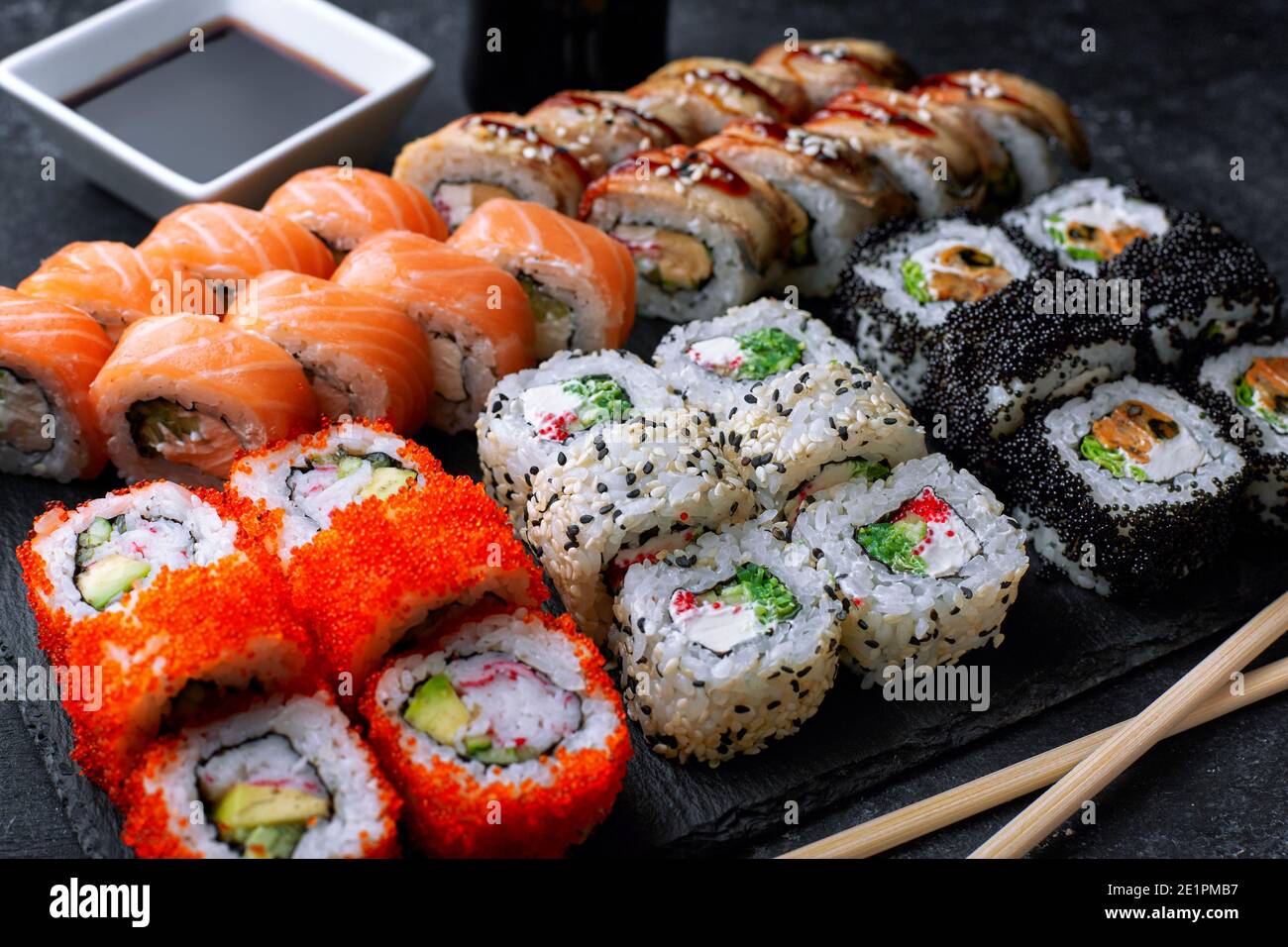 Sushi set, on a black background, five types of rolls Stock Photo