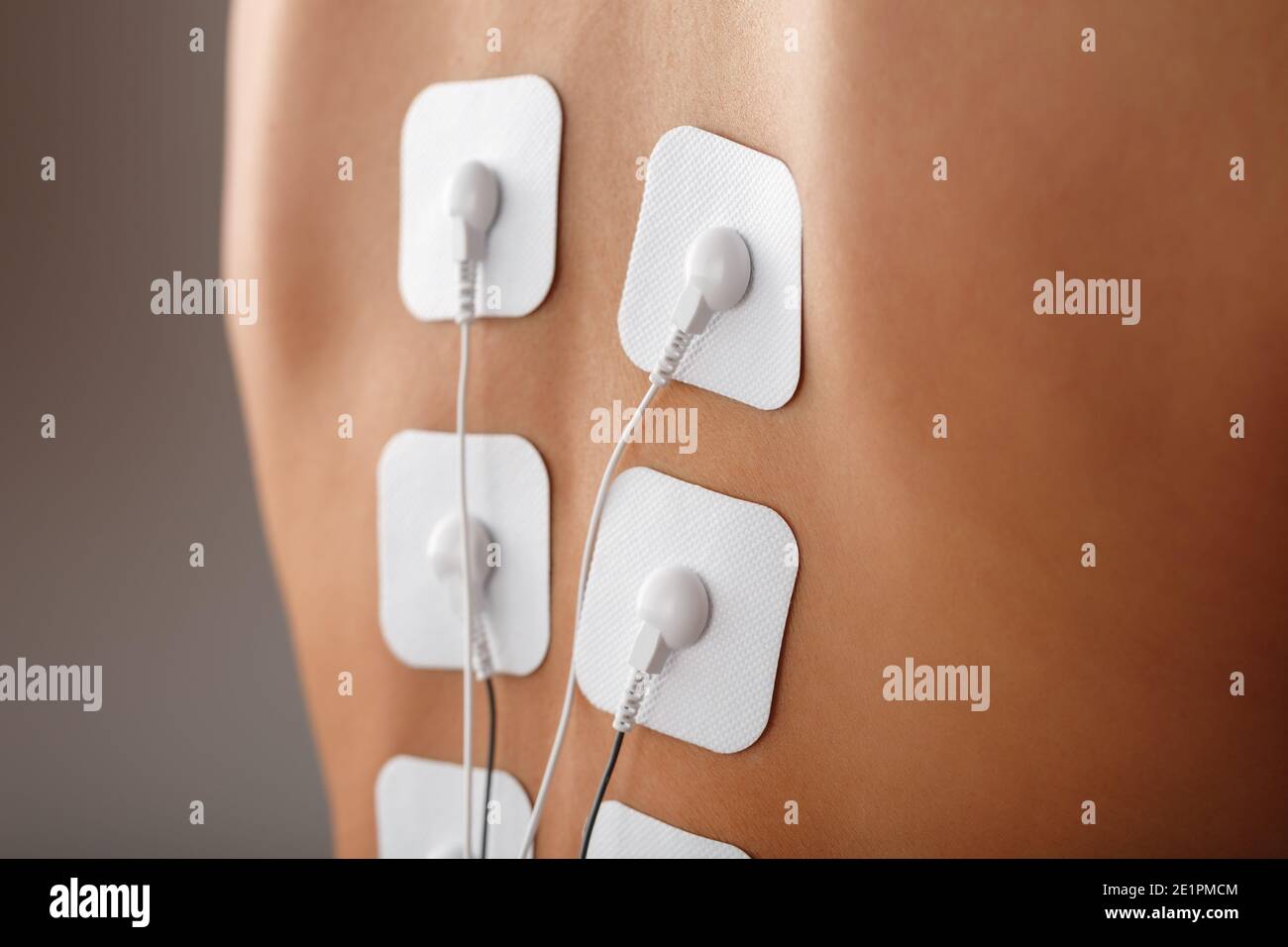 Electrode Stimulating massage of the spine at home. Medical procedure