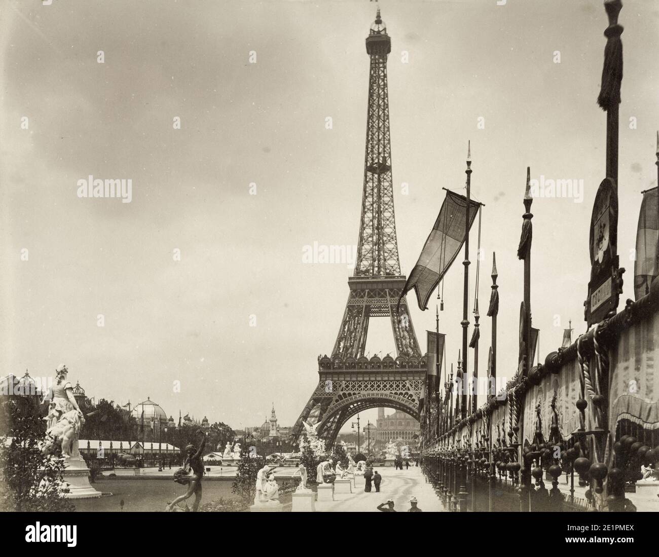 Vintage 1900 century photograph: Eiffel Tower Paris, recently completed and seen at the time of the Exposition Universelle. The Exposition Universelle of 1900, better known in English as the 1900 Paris Exposition, was a world's fair held in Paris, France, from 14 April to 12 November 1900, to celebrate the achievements of the past century and to accelerate development into the next. Stock Photo