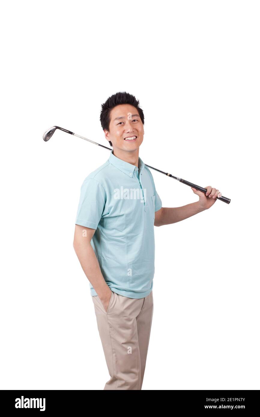 Young man holding golf swing and smiling high quality photo Stock Photo