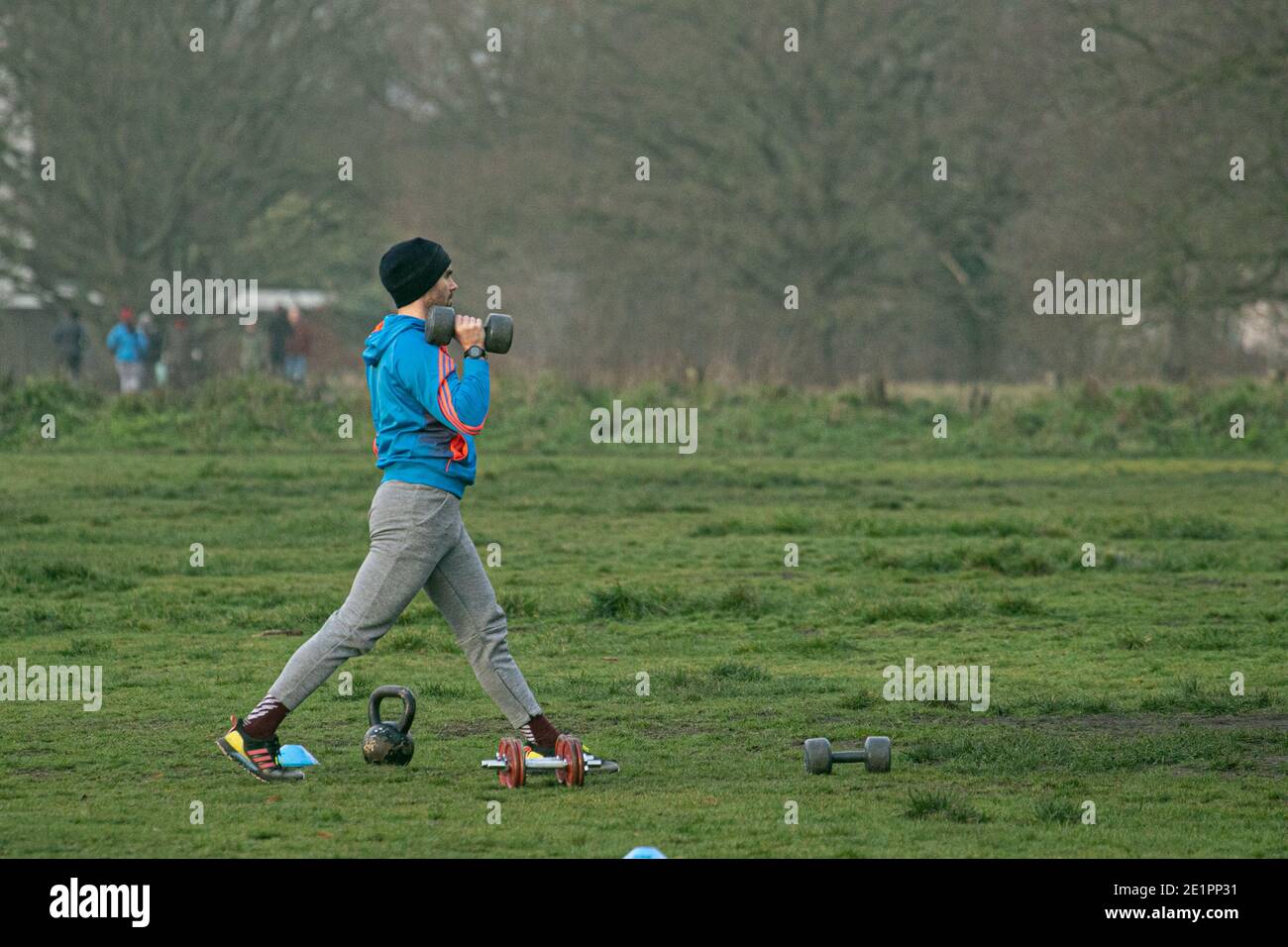 WIMBLEDON LONDON, UK. 9th Jan, 2021. A man exercising outdoors with weights on a cold frosty morning on Wimbledon Common. The government is urging people to stay at home to save lives in the wake of a spike in coronavirus deaths over the past days in order to relieve the pressure on the National Health Service Credit: amer ghazzal/Alamy Live News Stock Photo