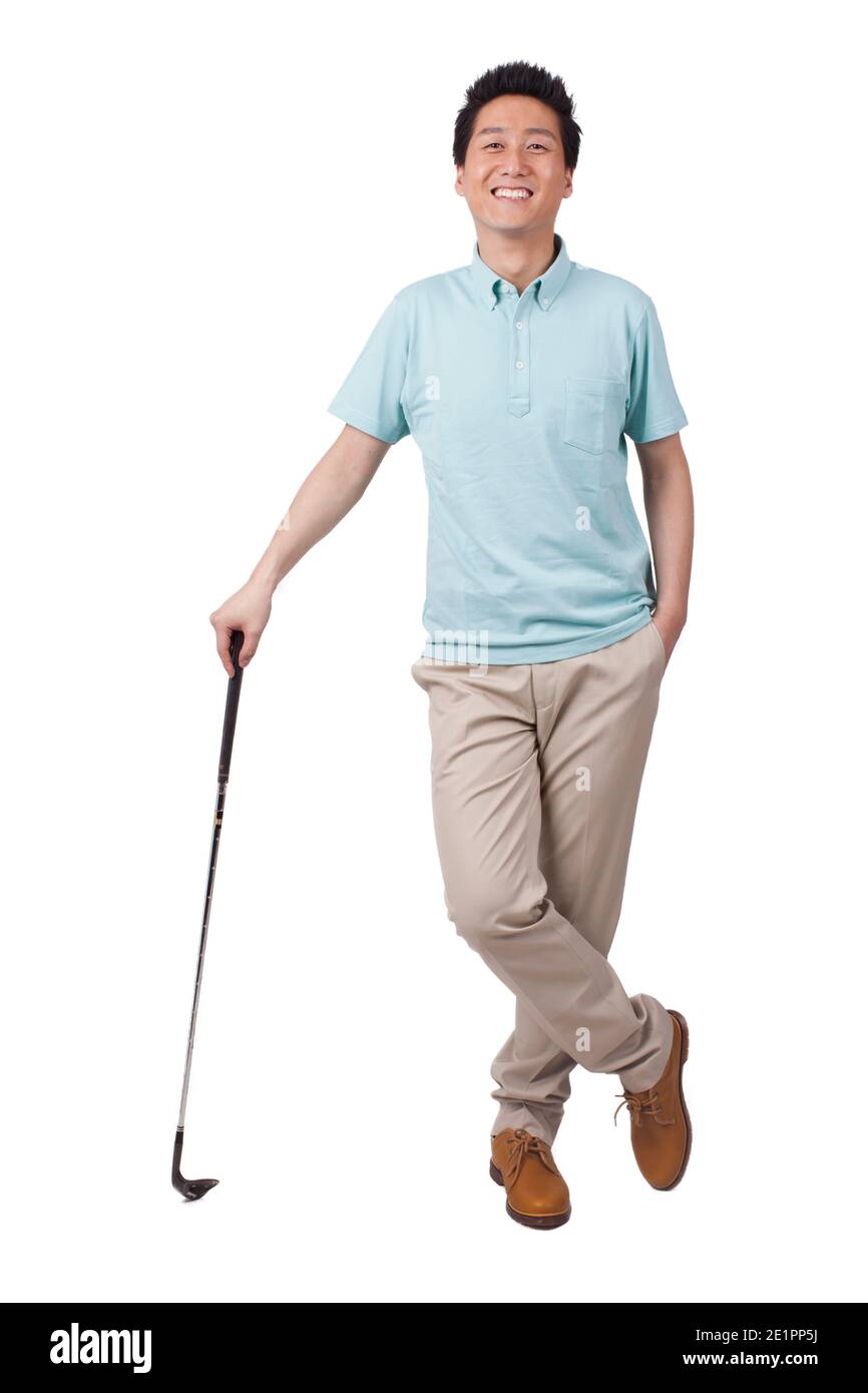 Young man holding golf swing and smiling high quality photo Stock Photo