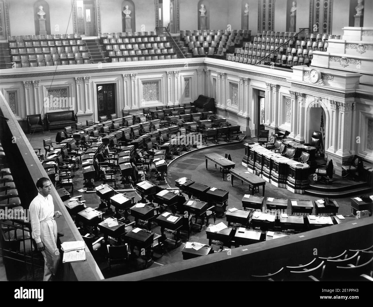 Director FRANK CAPRA on set candid on the empty US Senate Chamber Set built at Columbia Studios in Hollywood for filming of MR. SMITH GOES TO WASHINGTON 1939 director FRANK CAPRA story Lewis R. Foster screenplay Sidney Buchman art direction Lionel Banks Columbia Pictures Stock Photo