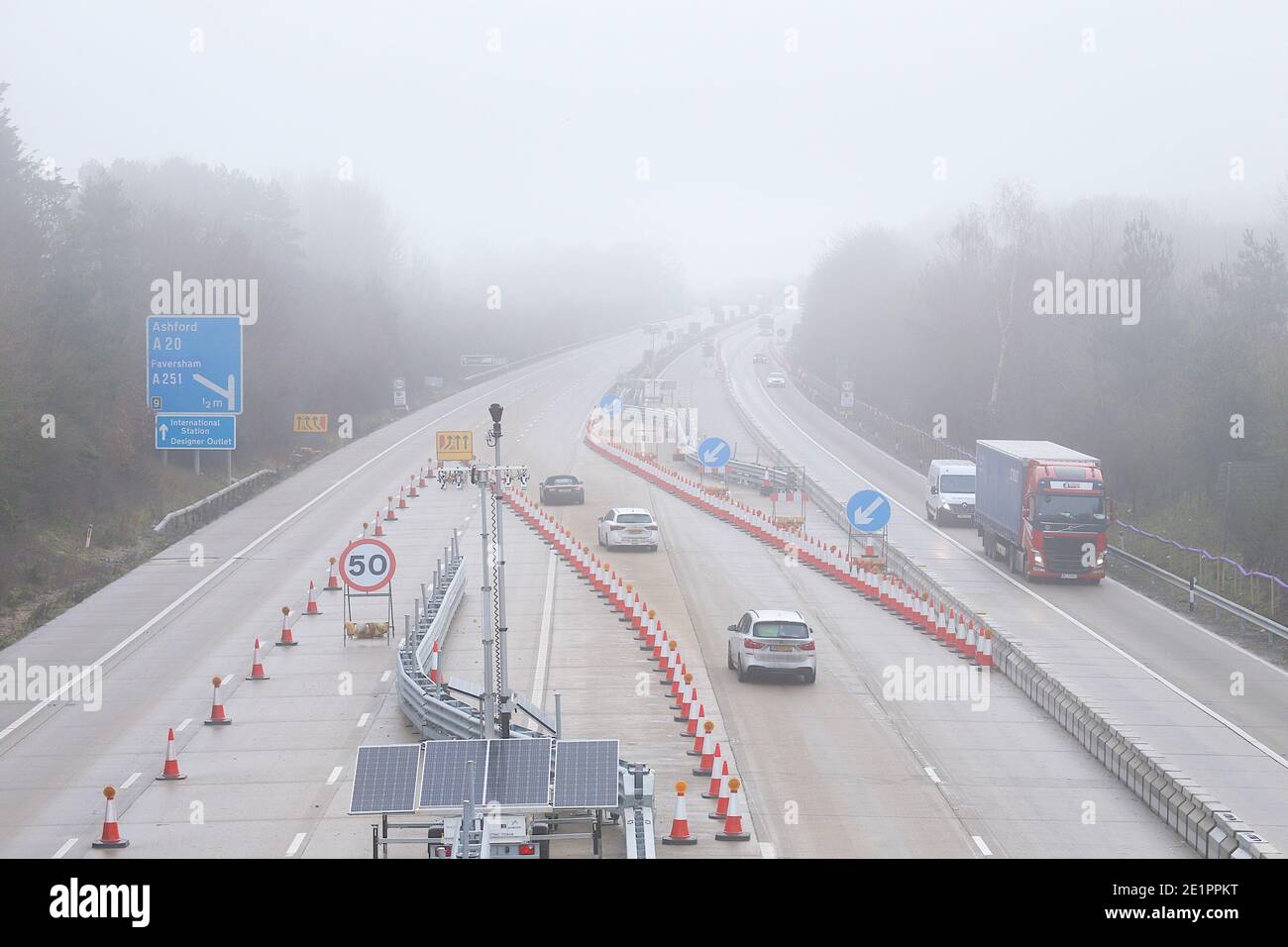 Ashford, Kent, UK. 09 Jan, 2021. UK Weather: Foggy weather on the M20 motorway near junction 9 in Ashford, Kent as Operation Brock is still in place, whereby the London lane is used by both directions for traffic. Photo Credit: Paul Lawrenson/Alamy Live News Stock Photo