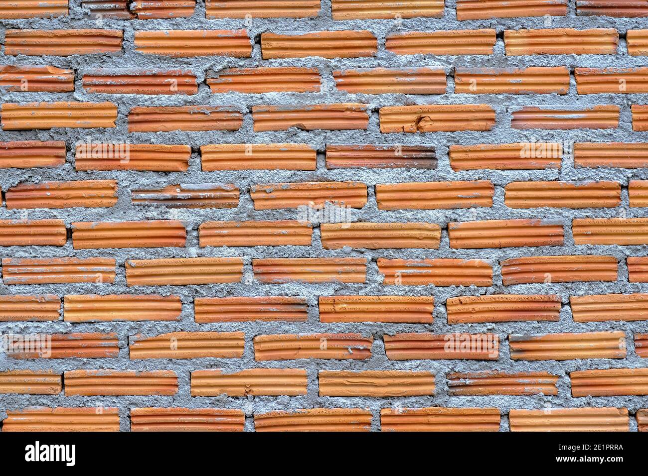Orange brick wall background with rough gunge texture. Stock Photo