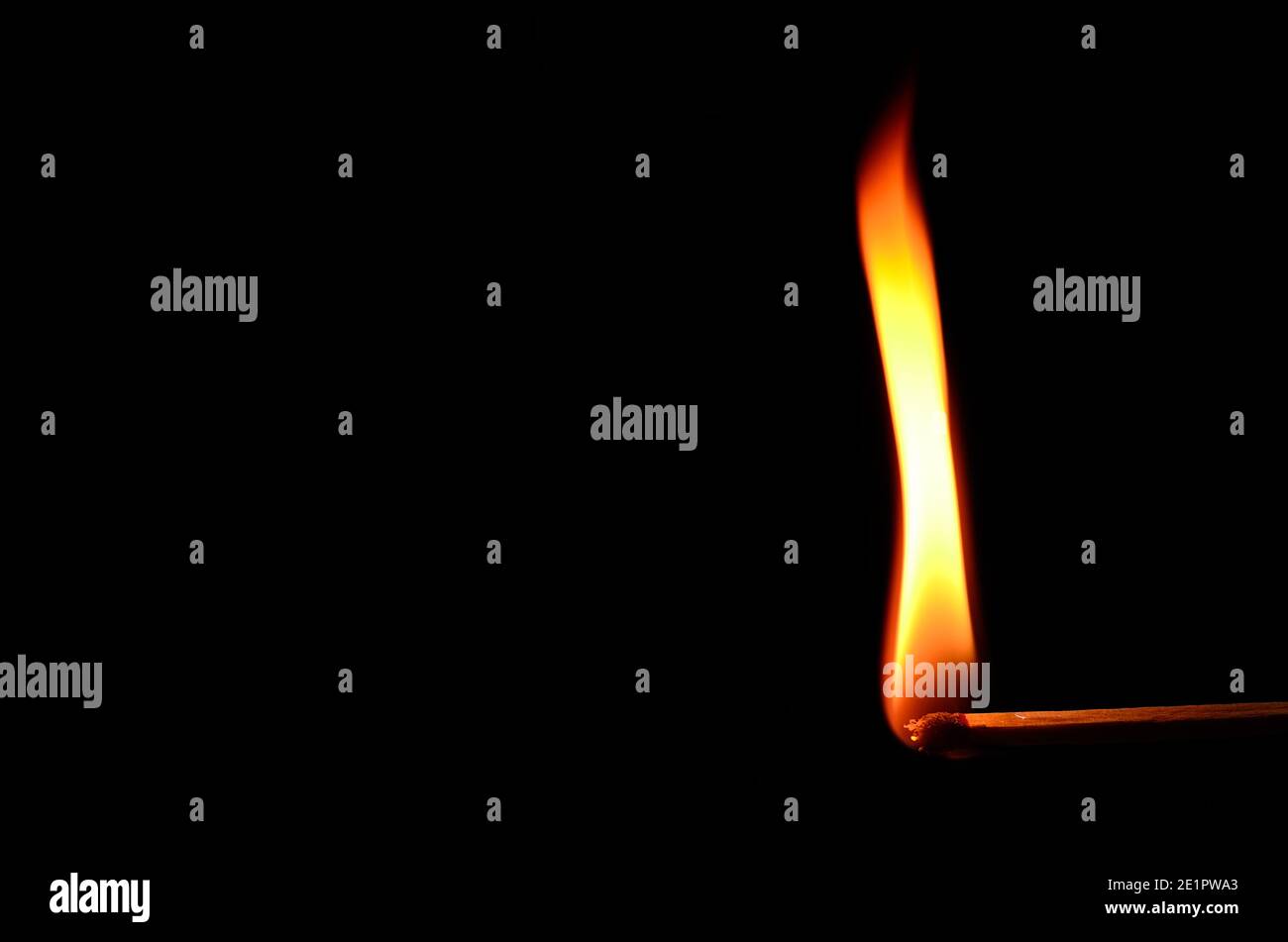match with high flame on black background Stock Photo