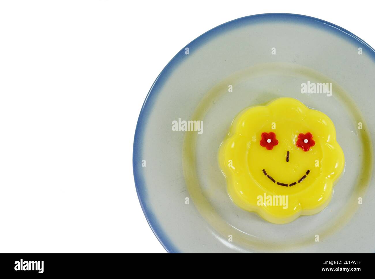 Vanilla pudding with smiles isolated on white background Stock Photo