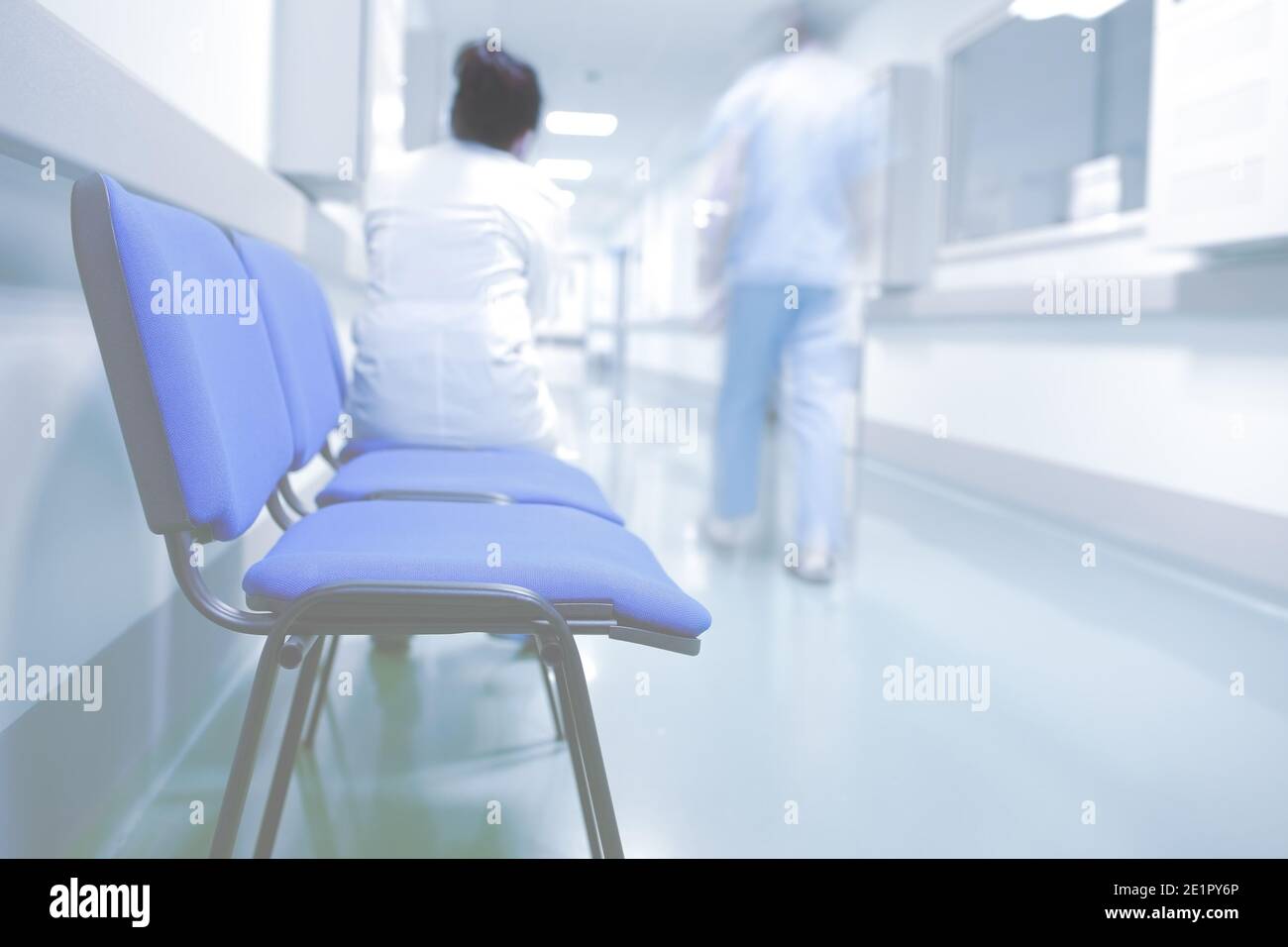 Medical workers in hospital hallway. Stock Photo