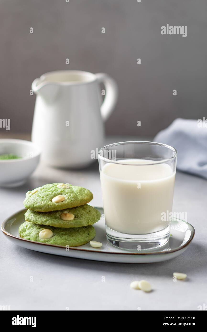 green tea matcha cookies with white chocolate and non dairy milk in glass Stock Photo