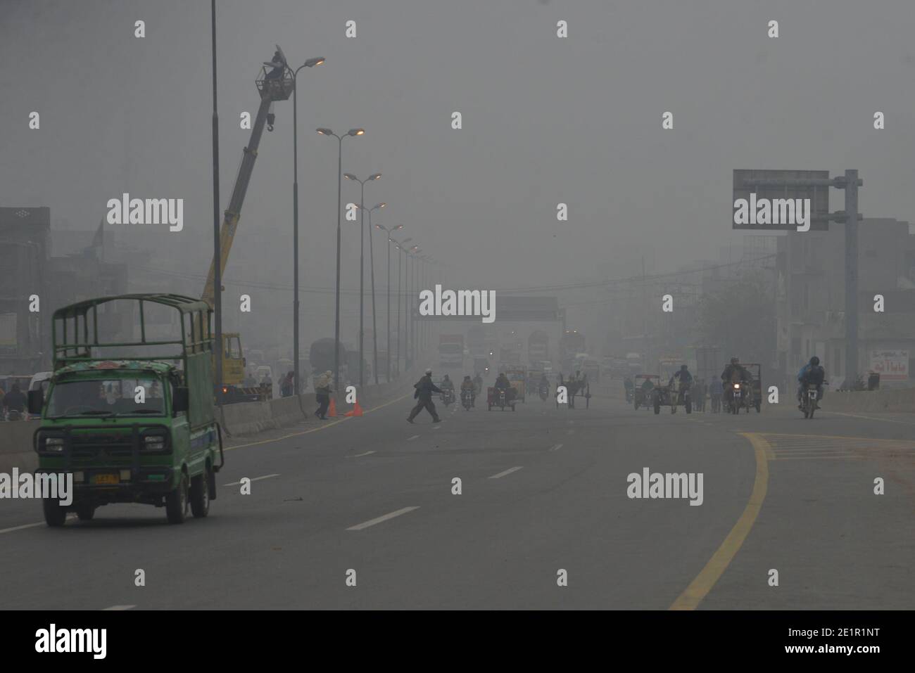 Lahore, Pakistan. 09th Jan, 2021. Pakistani commuters make their way