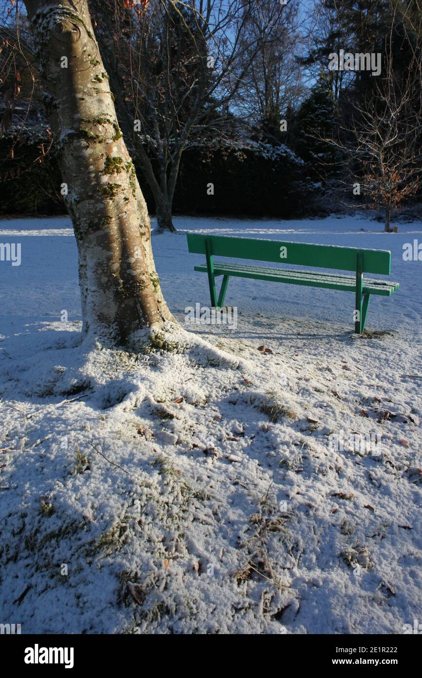 Exercising in winter parks. Woodlands covered in snow. Winter parks covered in snow in. Winter playground and winter activities in the UK. Stock Photo