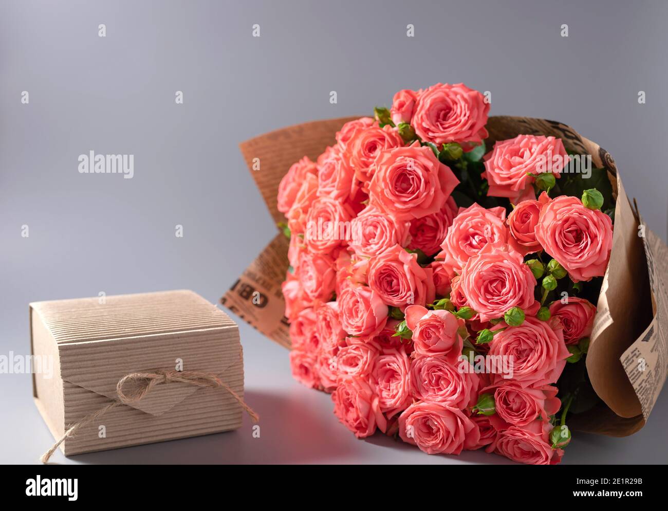 pink roses bouquet in vintage craft paper and gift box Stock Photo Alamy