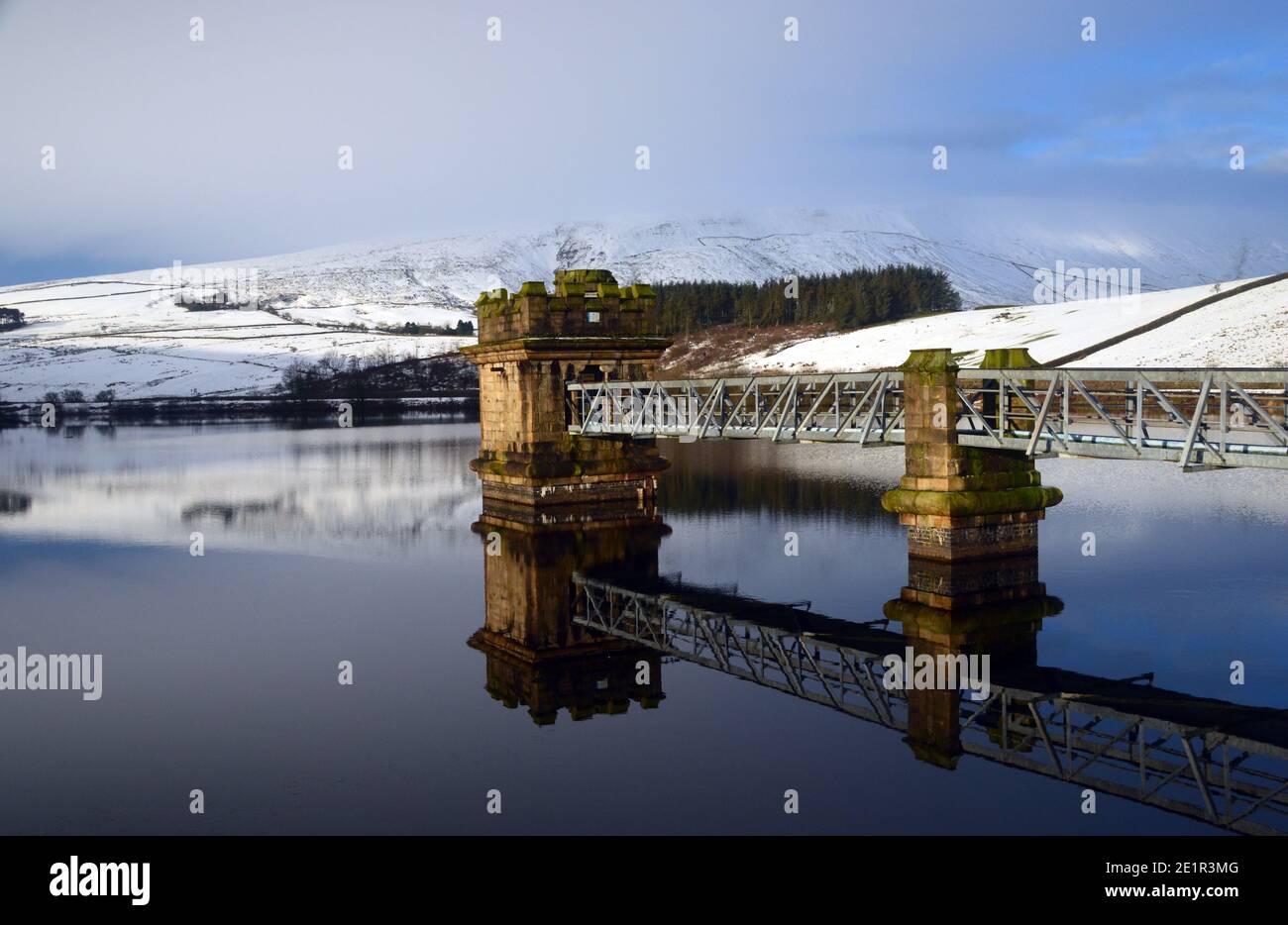 The Castellated Tower Value House on Lower Ogden Reservoir Dam near the Village of Barley from Path to Pendle Hill in Ogden Clough, Lancashire. UK. Stock Photo