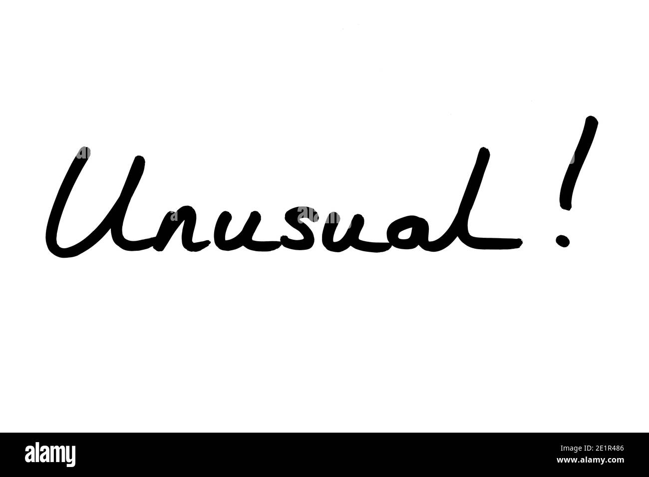 Unusual! handwritten on a white background. Stock Photo