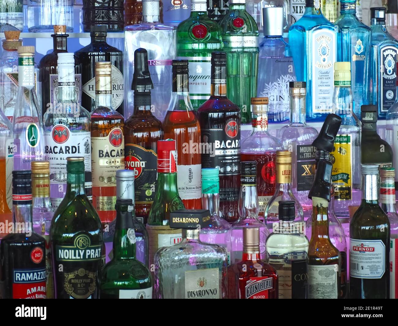 Many bottles of alcohol in a bar to create drinks Stock Photo