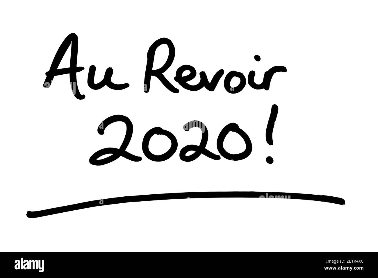 Au Revoir 2020! - meaning Goodbye 2020 in the French language - handwritten on a white background. Stock Photo
