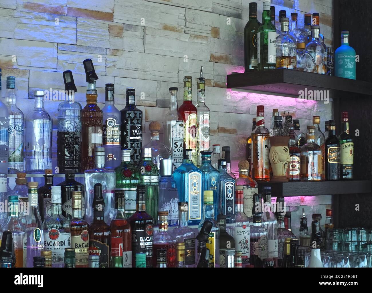 Many bottles of alcohol in a bar to create drinks Stock Photo