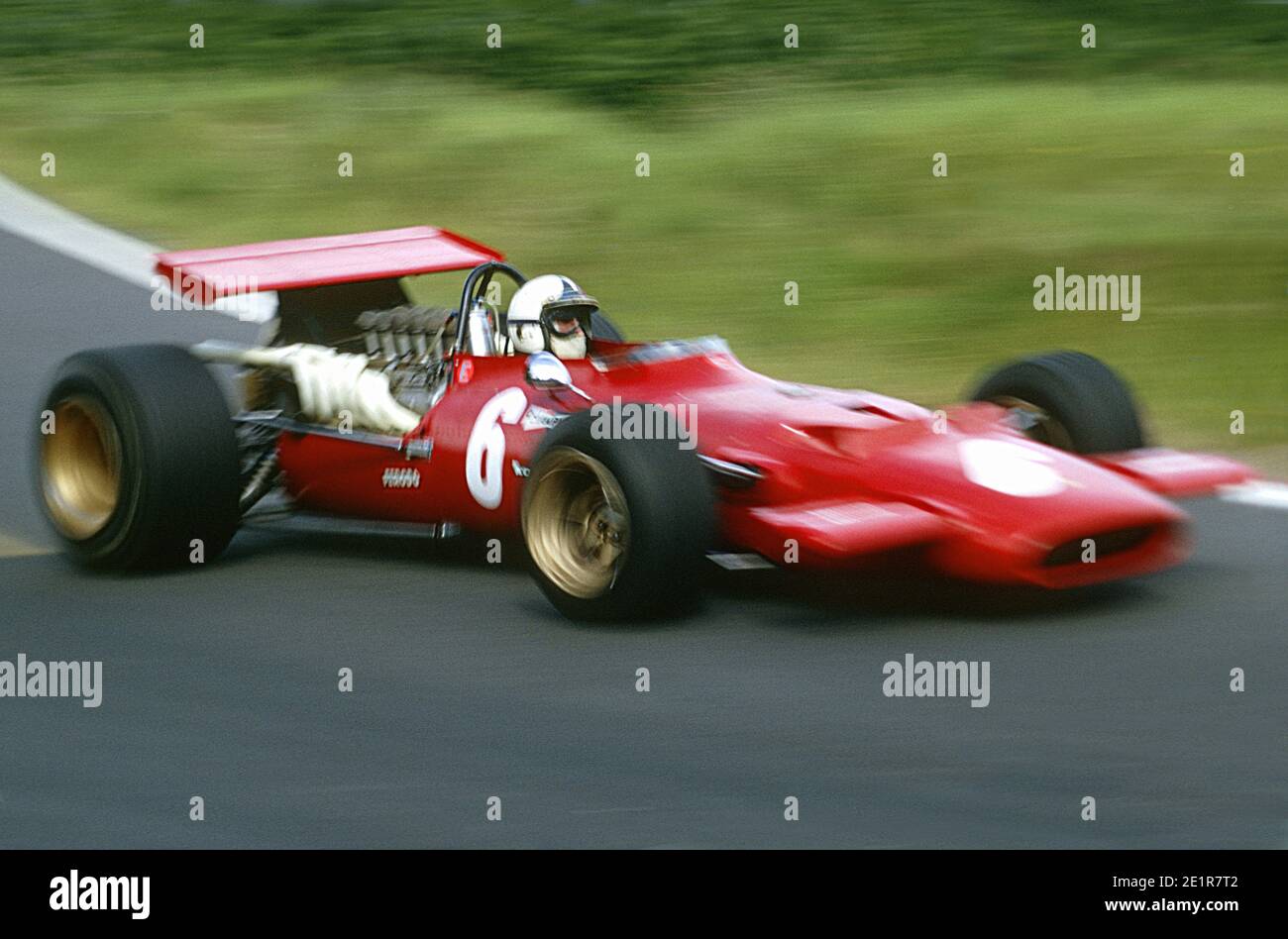 Chris AMON driving Ferrari F1 car in full speed during 1969 Grand Prix de France, in Charade circuit near Clermont-Ferrand. Stock Photo