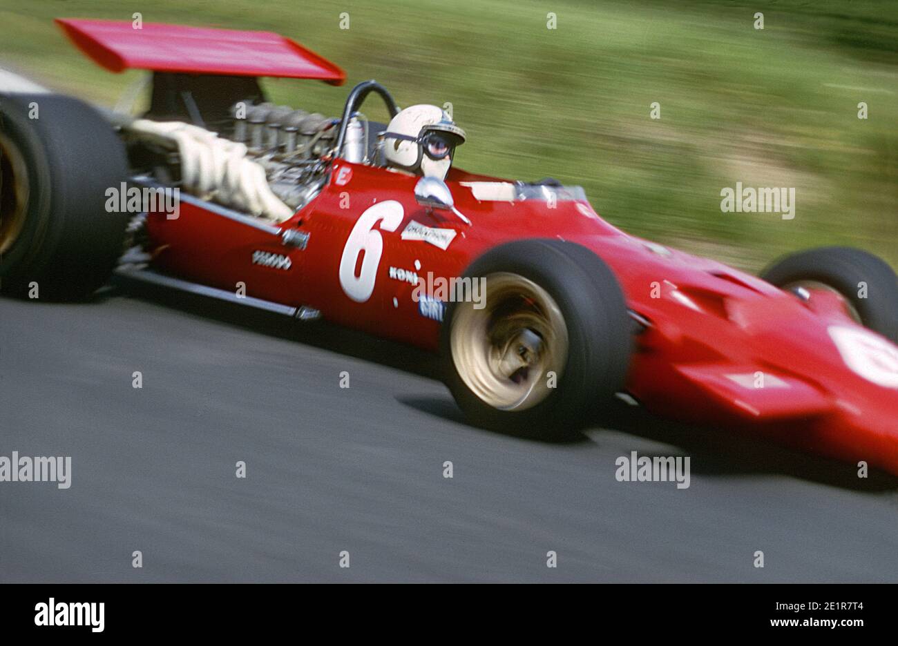 Chris AMON driving Ferrari F1 car in full speed during 1969 Grand Prix de France, in Charade circuit near Clermont-Ferrand. Stock Photo