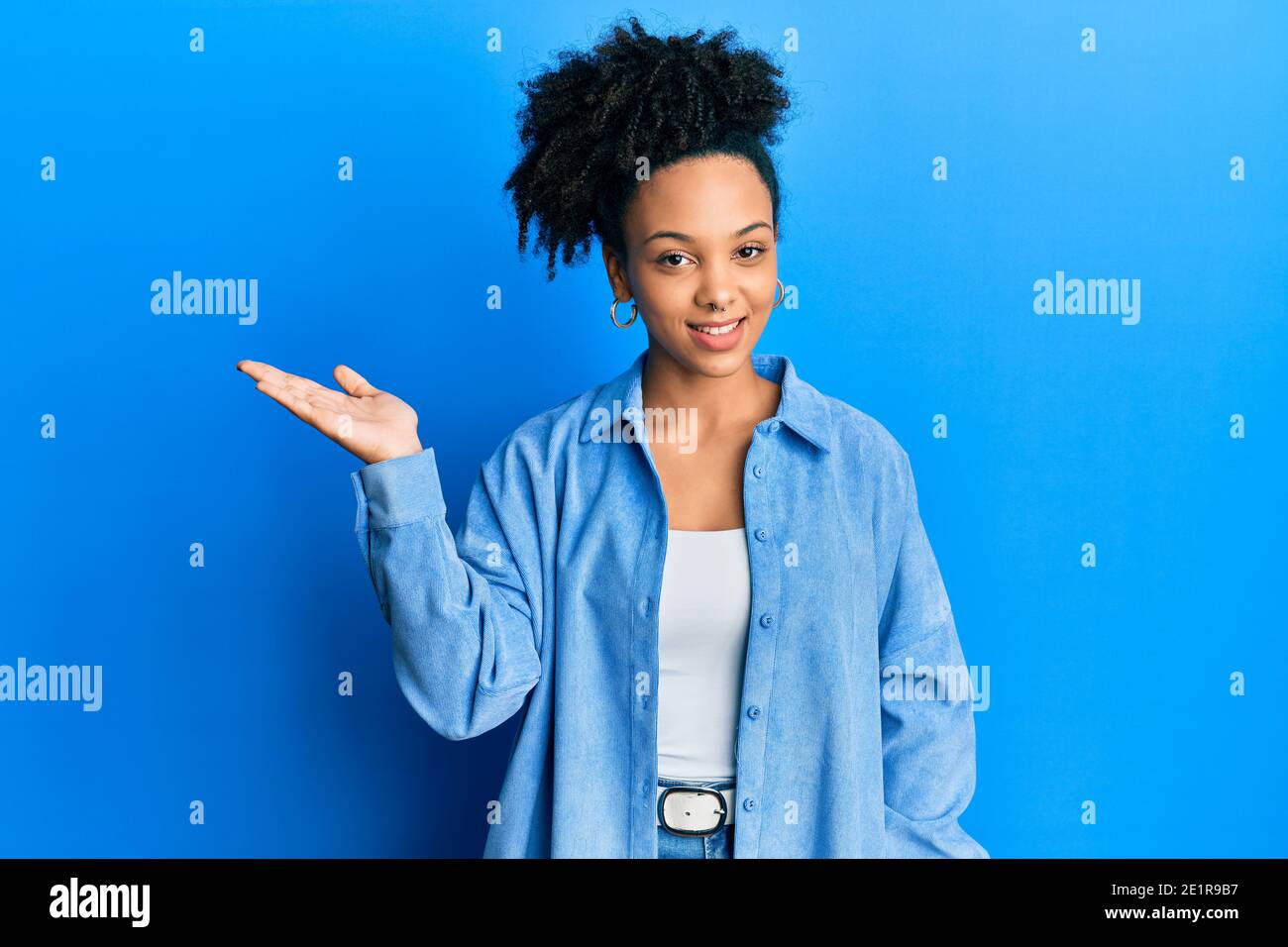 Young african american girl wearing casual clothes smiling cheerful ...