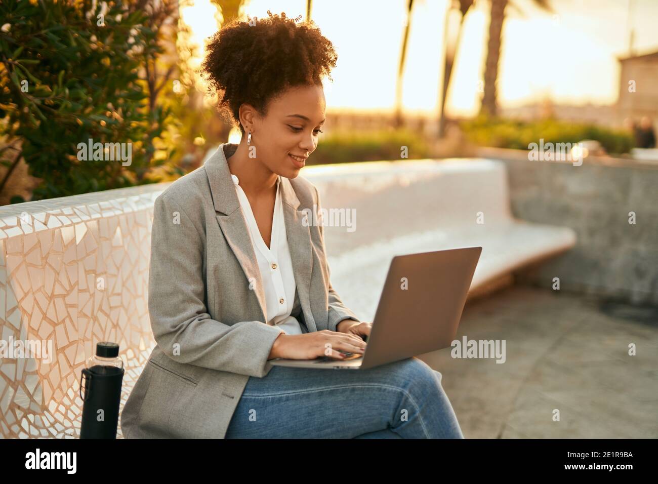 Young african american businesswoman working using laptop sitting on ...
