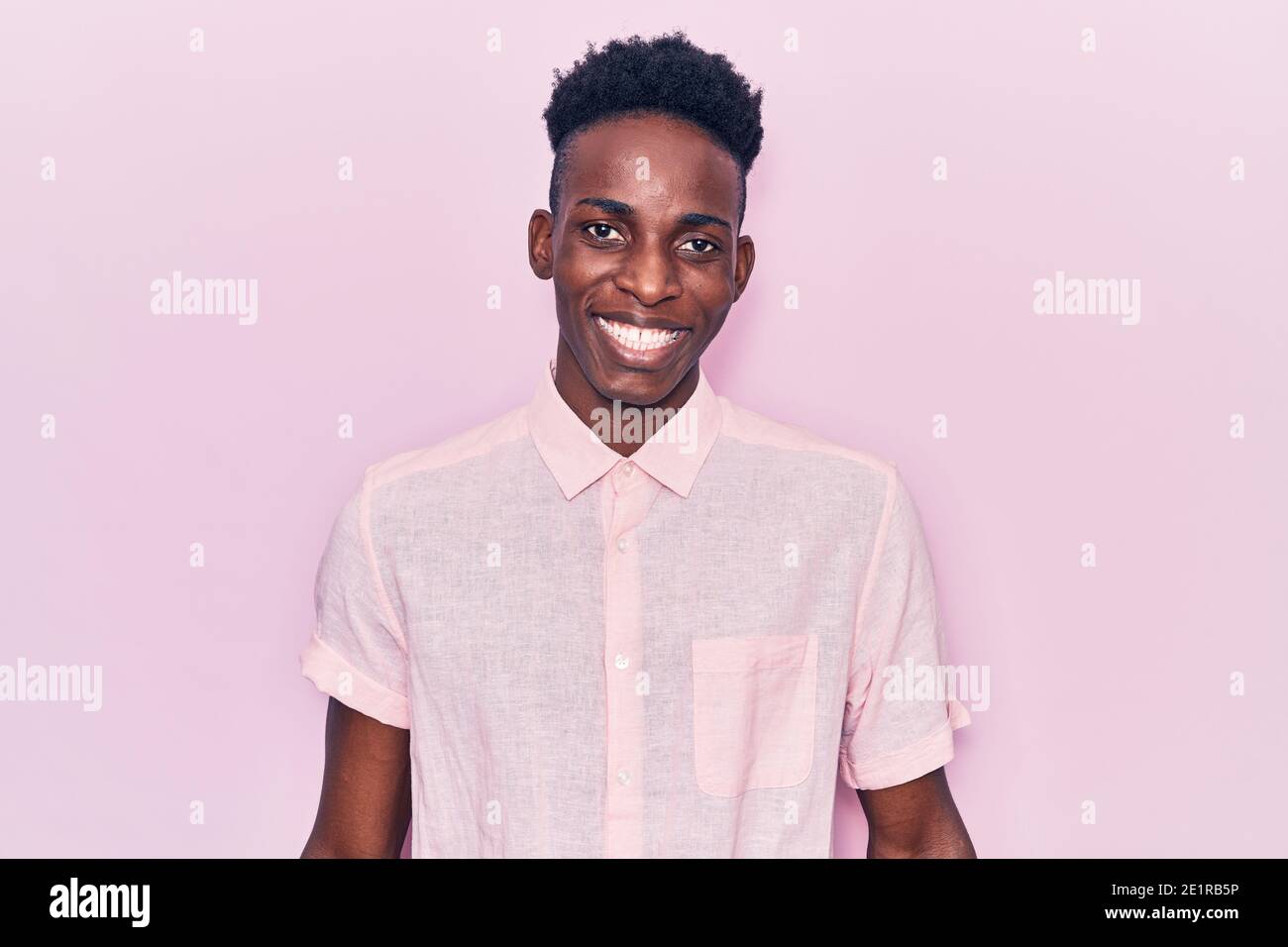 Young african american man wearing casual clothes looking positive and ...