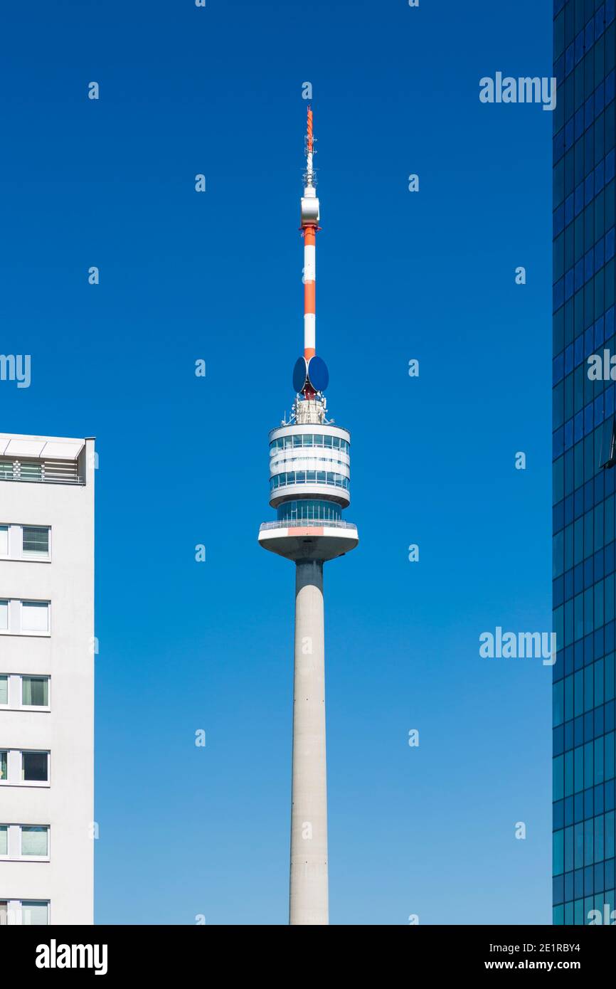 The Donauturm (Danube Tower) framed by skyscrapers in the Donau City in Vienna, Austria. Stock Photo