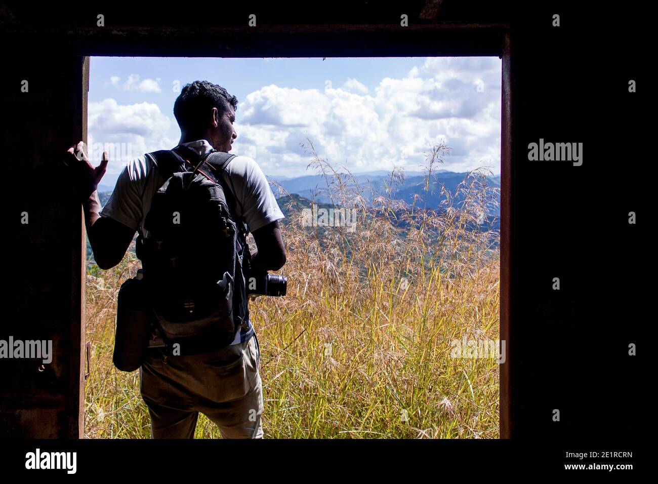 A man with a camera on his trip through the mountains of Miranda in Venezuela Stock Photo