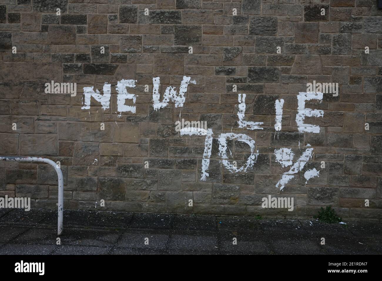 Glasgow, UK, 9 January 2021. In the week when the UK saw record numbers of cases of Covid-19 being recorded, and daily record numbers of deaths, conspiracy theory graffiti declaring Corona Virus, and the new variant of the virus, a hoax has appeared on the walls of Drumchapel in the north of the city. Photo credit: Jeremy Sutton-Hibbert/Alamy Live News Stock Photo