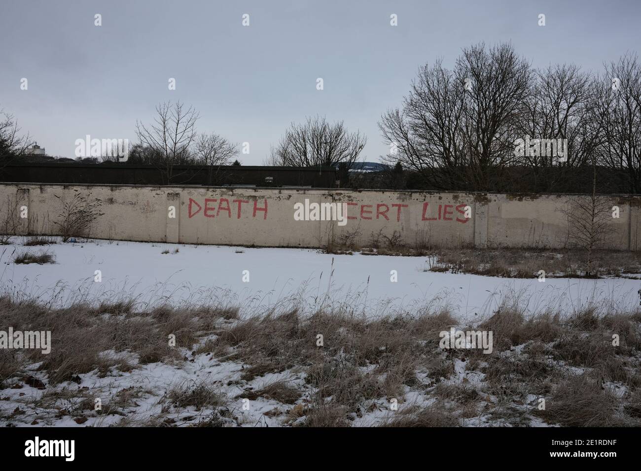 Glasgow, UK, 9 January 2021. In the week when the UK saw record numbers of cases of Covid-19 being recorded, and daily record numbers of deaths, conspiracy theory graffiti declaring Corona Virus a hoax, and 'Death certificate lies', has appeared on the walls of Drumchapel in the north of the city. Photo credit: Jeremy Sutton-Hibbert/Alamy Live News Stock Photo