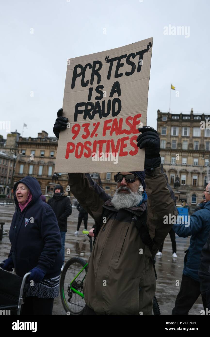 Glasgow, UK, 9 January 2021. In the week when the UK saw record numbers of cases of Covid-19 being recorded, and daily record numbers of deaths, a small gathering of people protesting against lockdown, mask-wearing, social distancing and vaccinations, took place in George Square, in the city centre. Photo credit: Jeremy Sutton-Hibbert/Alamy Live News Stock Photo