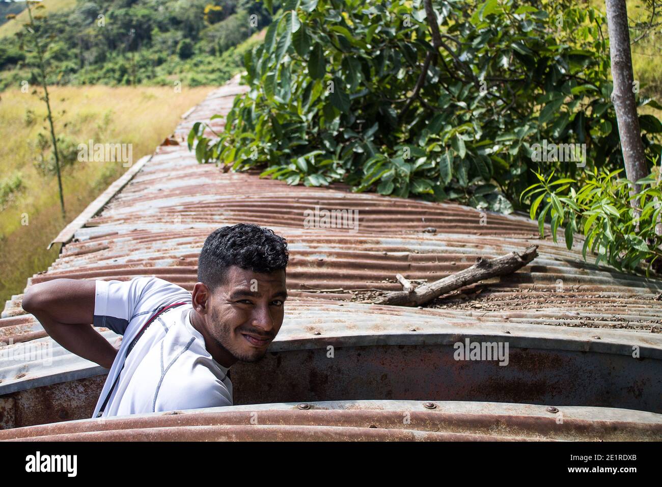 A man with a camera on his trip through the mountains of Miranda in Venezuela Stock Photo