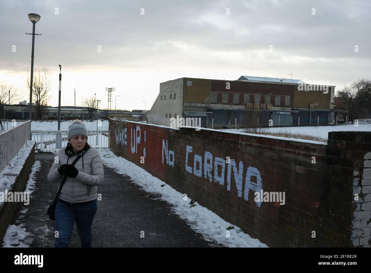 Glasgow, UK, 9 January 2021. In the week when the UK saw record numbers of cases of Covid-19 being recorded, and daily record numbers of deaths, conspiracy theory graffiti declaring Corona Virus a hoax has appeared on the walls of Drumchapel in the north of the city. Photo credit: Jeremy Sutton-Hibbert/Alamy Live News Stock Photo