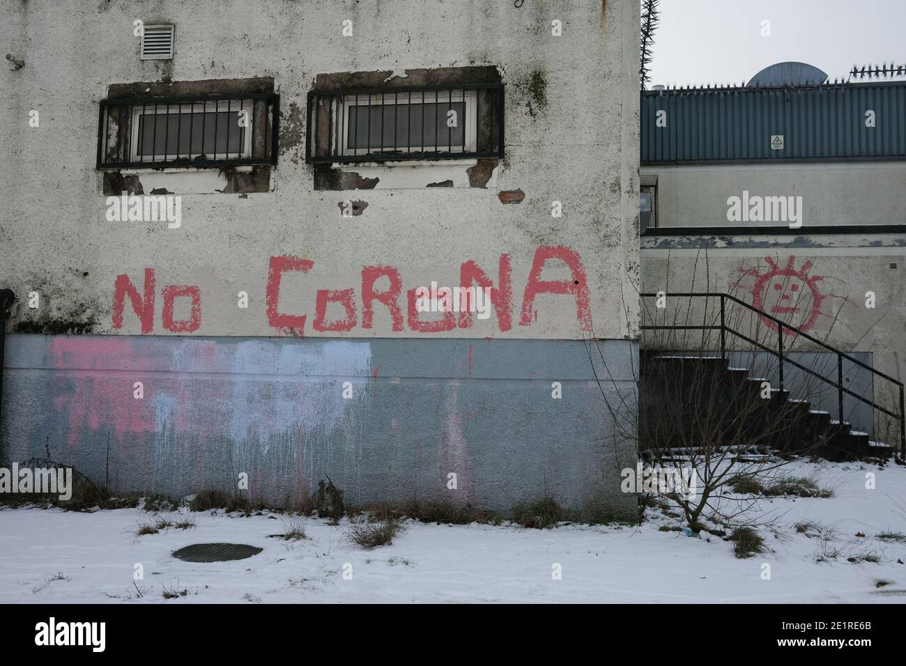 Glasgow, UK, 9 January 2021. In the week when the UK saw record numbers of cases of Covid-19 being recorded, and daily record numbers of deaths, conspiracy theory graffiti declaring Corona Virus a hoax has appeared on the walls of Drumchapel in the north of the city. Photo credit: Jeremy Sutton-Hibbert/Alamy Live News Stock Photo