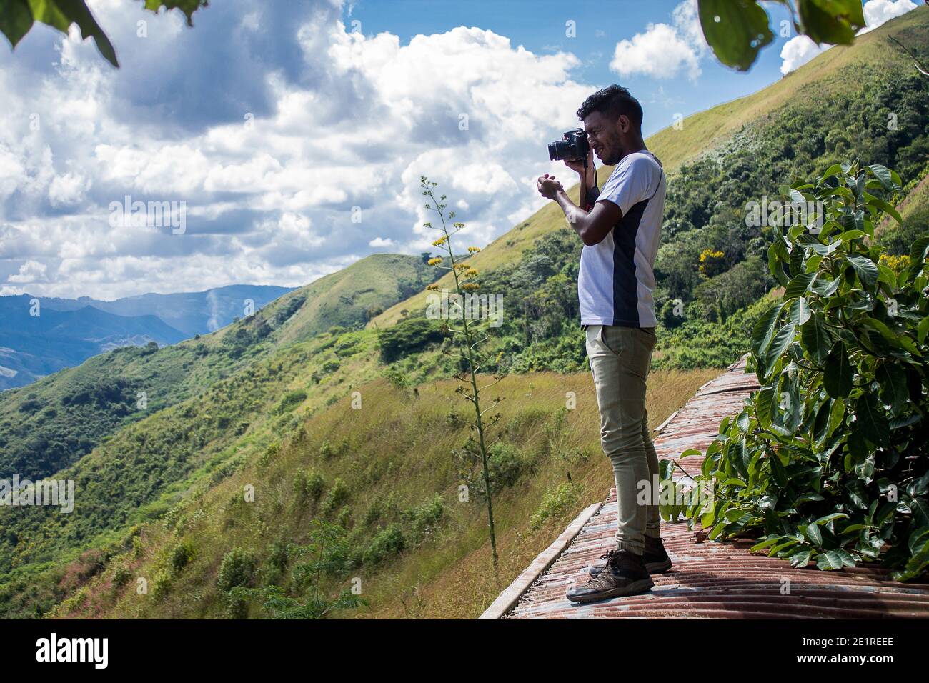 A man with a camera on his trip through the mountains of Miranda in Venezuela Stock Photo