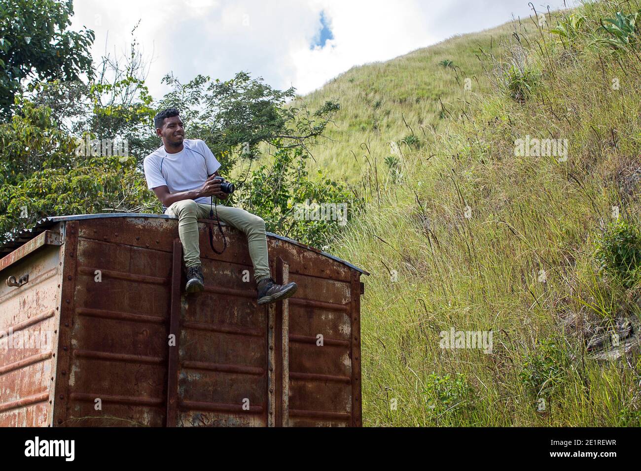 A man with a camera on his trip through the mountains of Miranda in Venezuela Stock Photo