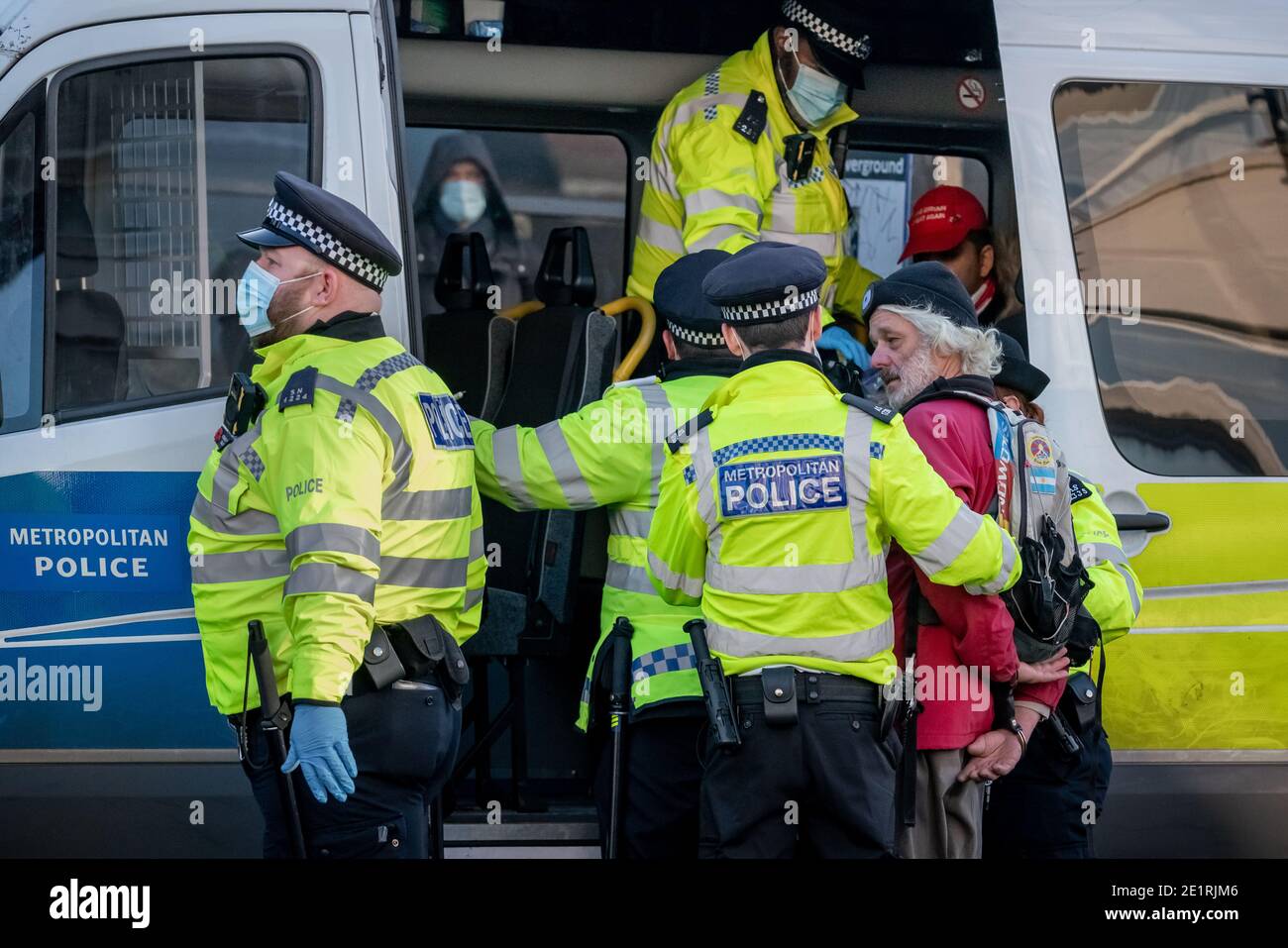 London, UK. 9th Jan, 2021. Coronavirus: Arrests are made during an attempted anti-lockdown gathering in Clapham Common against the current government lock-down restrictions including public social-distancing and large-scale gatherings. The conspiratorial supporters reject vaccines and claim the COVID-19 pandemic is a hoax. Credit: Guy Corbishley/Alamy Live News Stock Photo