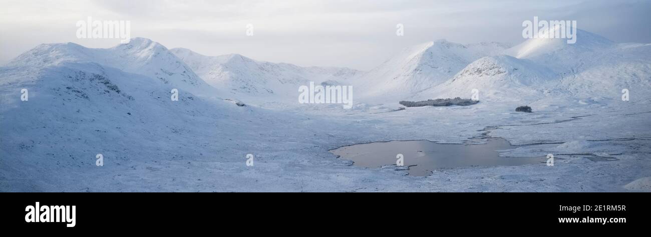Rannoch Moor and Black Mount covered in snow during winter aerial view Stock Photo