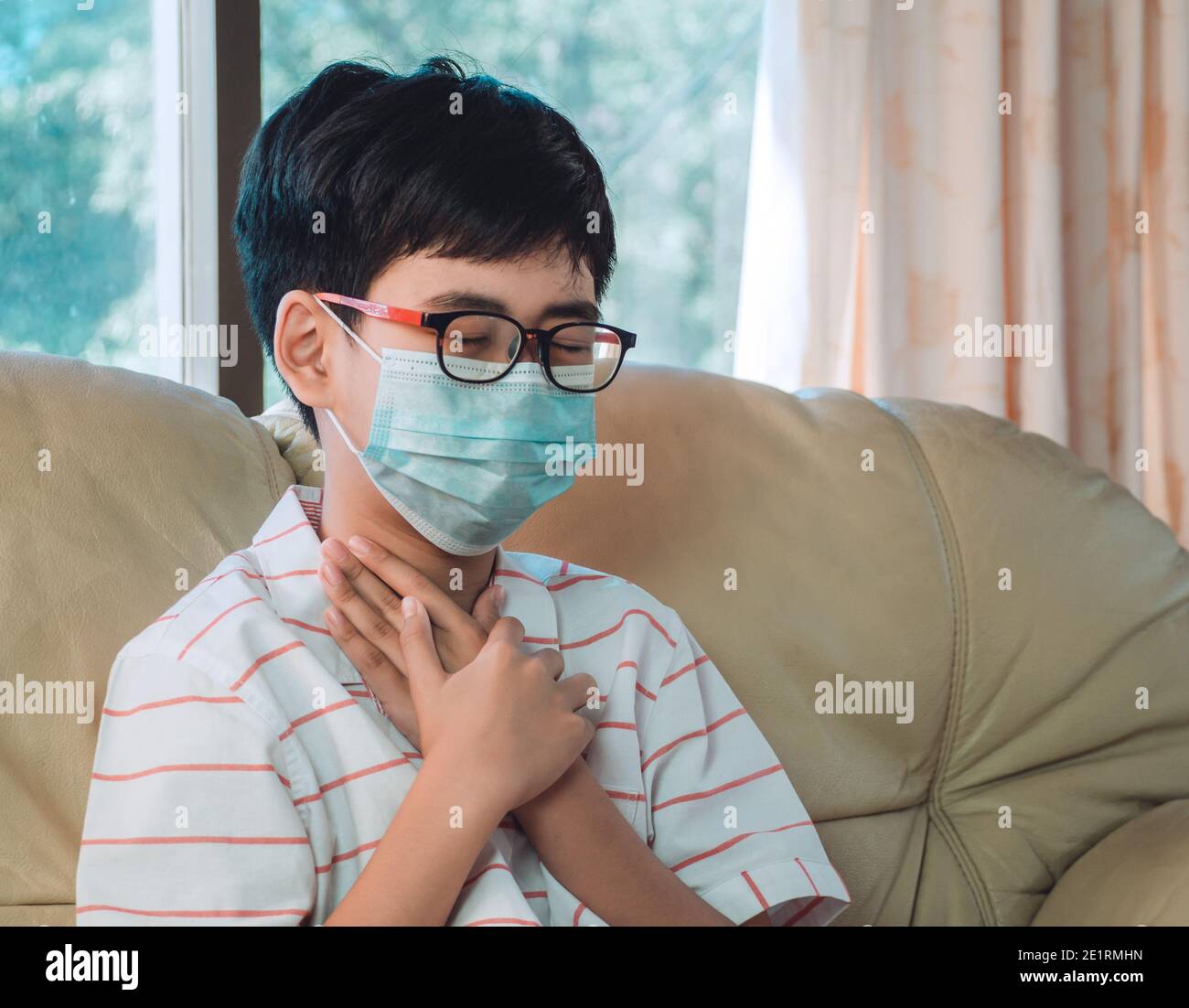 Little ill boy get sore throat or choking can't breath with unhappy and