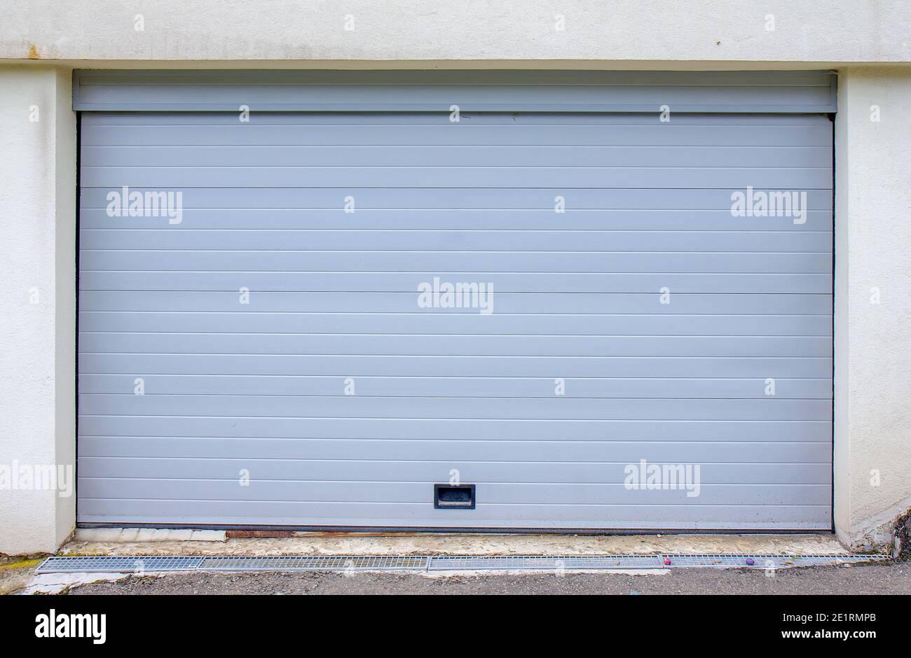 Plastic white garage door - exterior Stock Photo