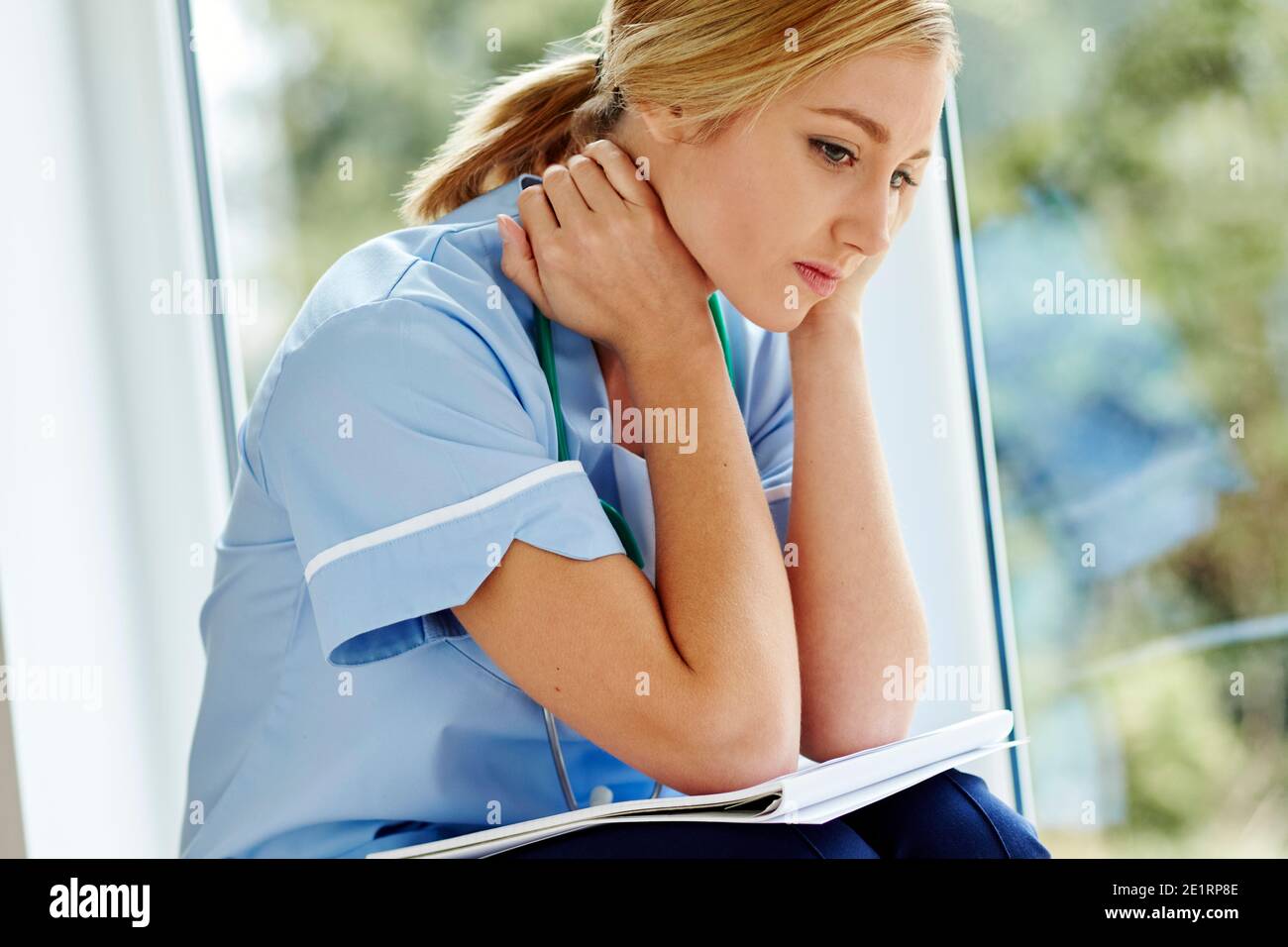 Tired nurse at work Stock Photo Alamy