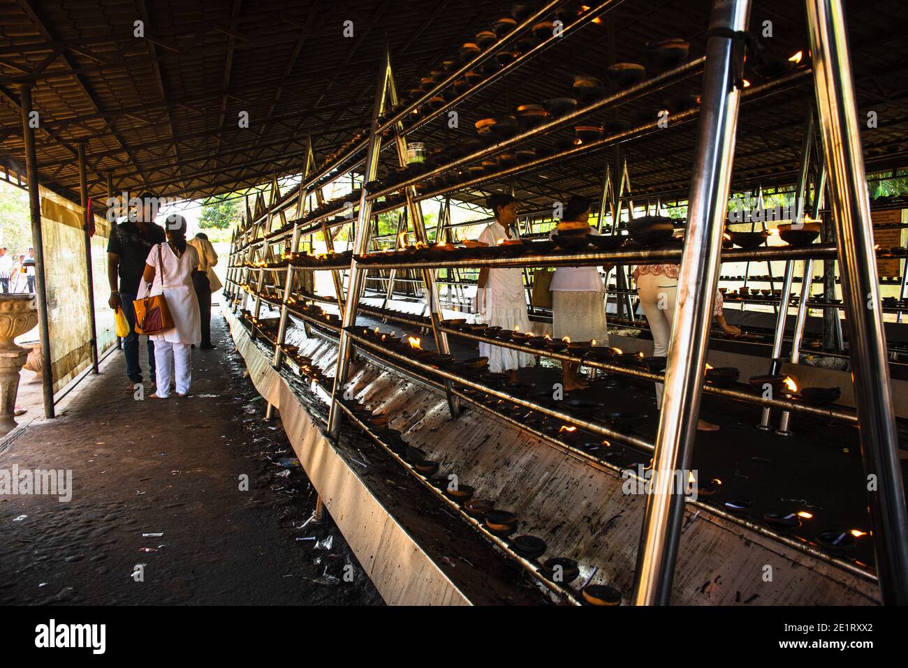 Candles at a offering shrine at Anuradhapudra Sri Lanka Stock Photo Alamy