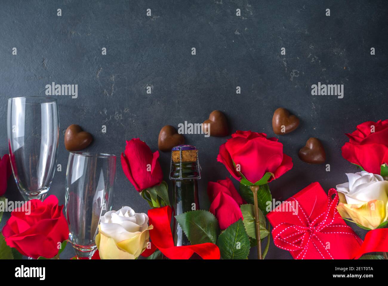 Valentines day greeting card concept with red rose flowers, champagne ...