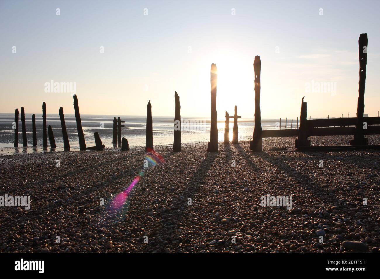 Winchelsea beach landscape view low tide exposing flat sand with wooden