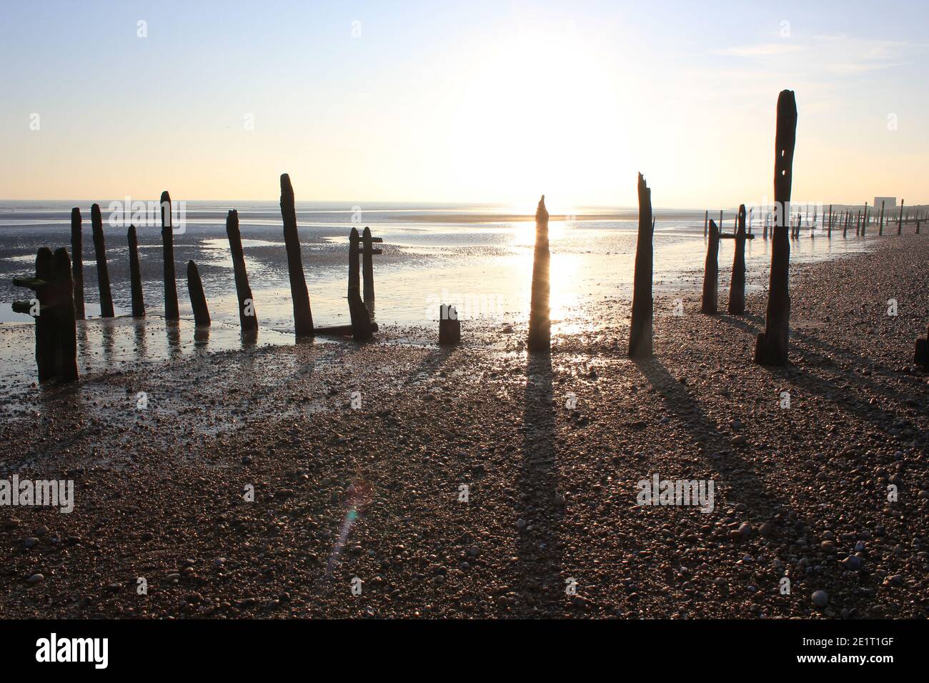 Winchelsea beach landscape view low tide exposing flat sand with wooden