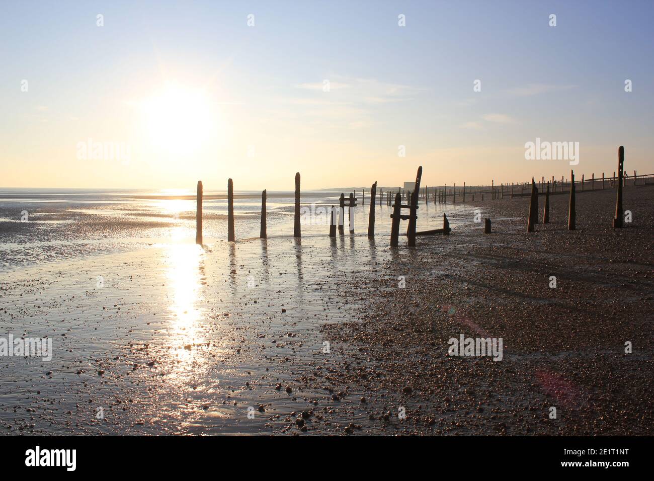 Winchelsea beach landscape view low tide exposing flat sand with wooden