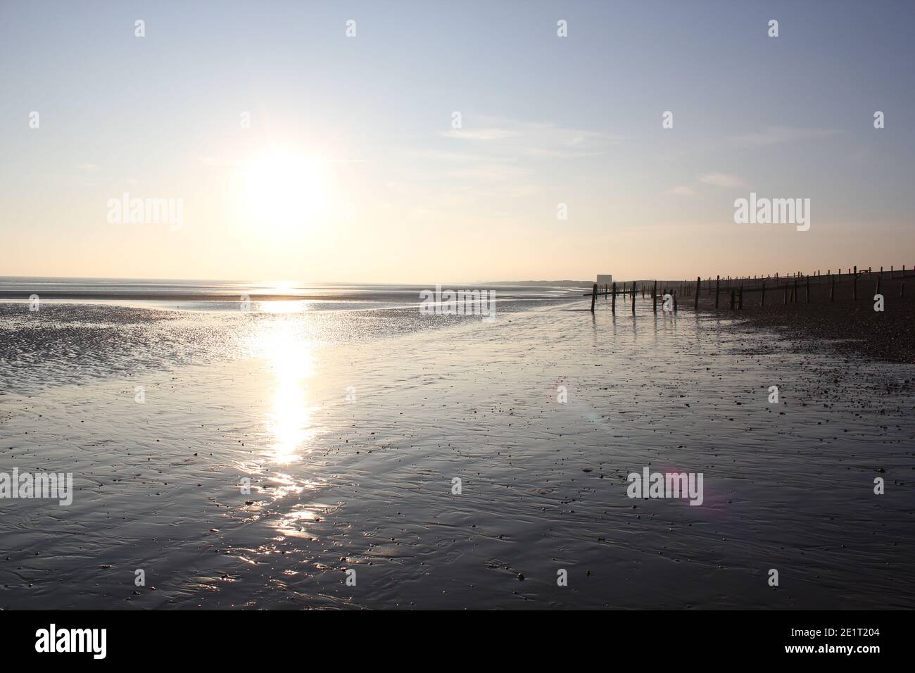 Winchelsea beach landscape view low tide exposing flat sand with wooden